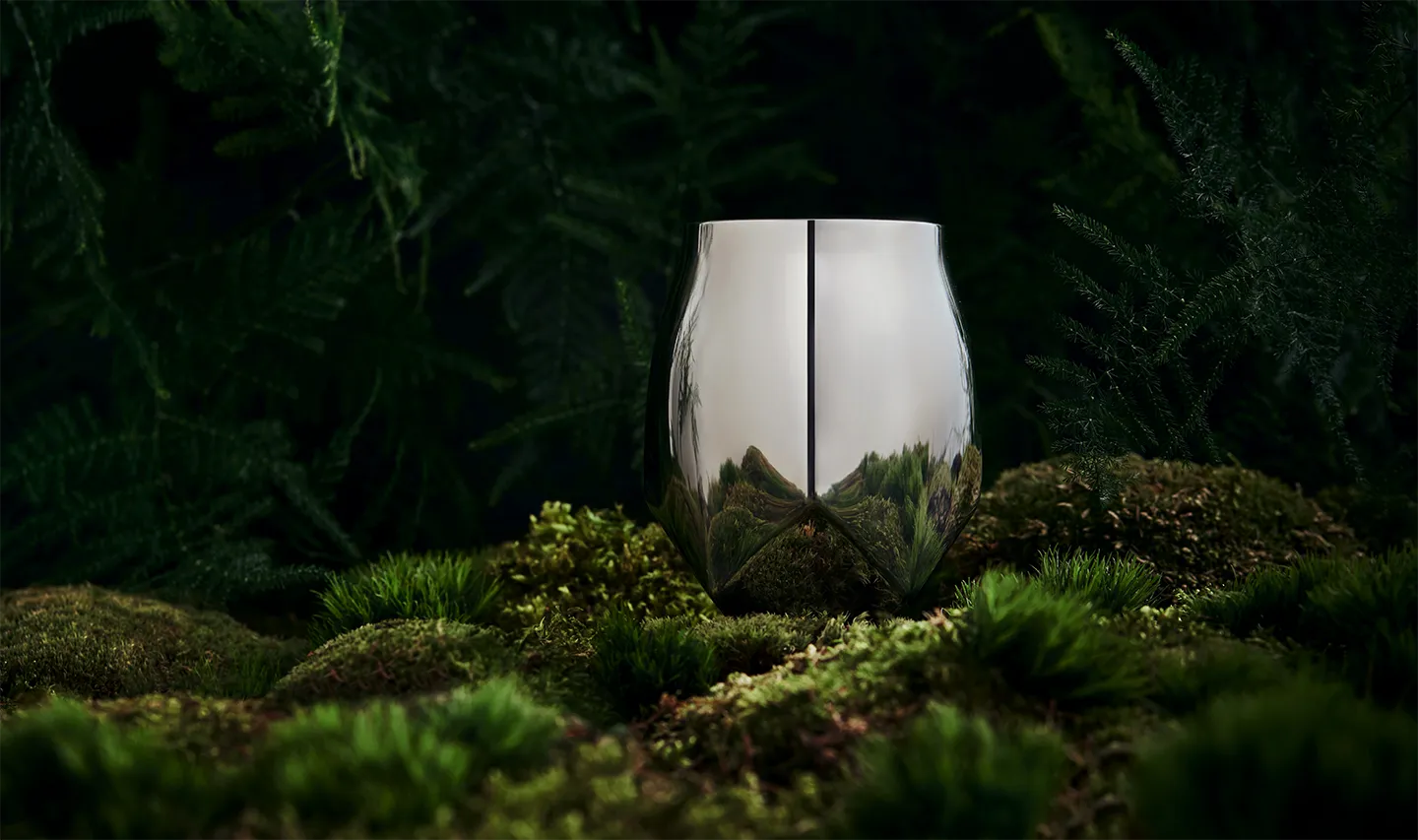 The Norlan Steel Tumbler, ideal for enjoying drinks outdoors, shown here on a mossy foreground