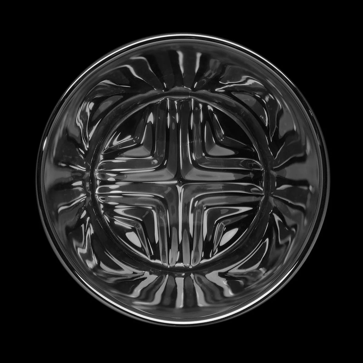 Detail of the interior of the gray Vawe Highball glass with patterned base to aid in muddling mixed drinks